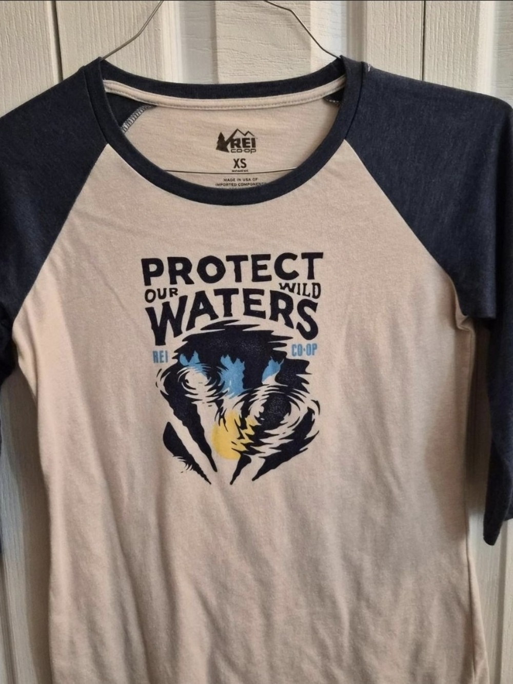 REI Women's Raglan Tee in Navy and Cream with Protect Our Wild Waters Graphic